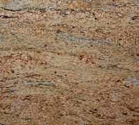 Close-up of granite surface with swirling patterns in shades of gold, brown, and black.