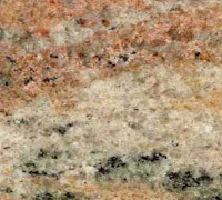 Close-up of granite with tan, peach, and black speckled patterns.