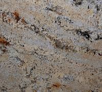 Close-up of granite surface with beige, brown, and black swirling patterns.