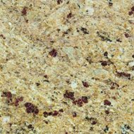 Granite countertop with speckled tan and maroon patterns.