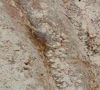 Close-up of granite surface with beige, brown, and grey swirls and speckled patterns.