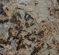 Close-up of granite countertop with tan, brown, and gray mottled pattern.