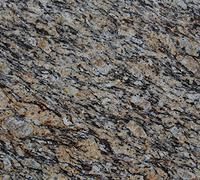 Golden granite with black and gray speckles and wavy patterns.