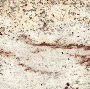 Cream-colored granite countertop with brown and gray flecks and streaks.