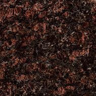 Brown granite surface with dark and reddish-brown flecks.