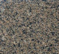 Brown and gray speckled granite stone surface.
