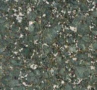 Green granite stone surface with white and gray flecks.