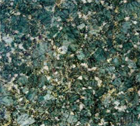 Green and white flecked granite surface.