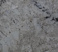 Gray and white granite with dark veins and patches.