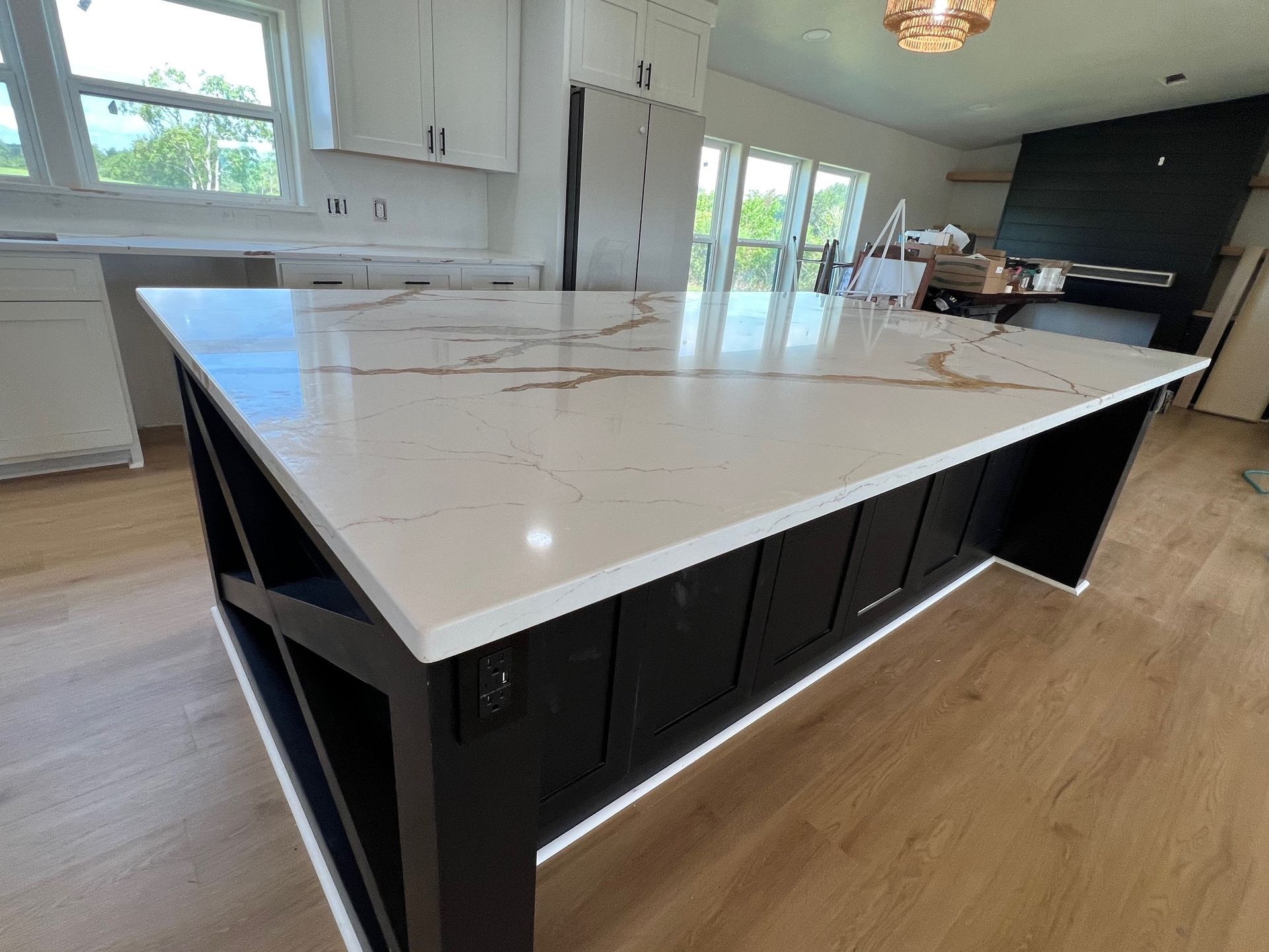 There is a large island in the middle of the kitchen.