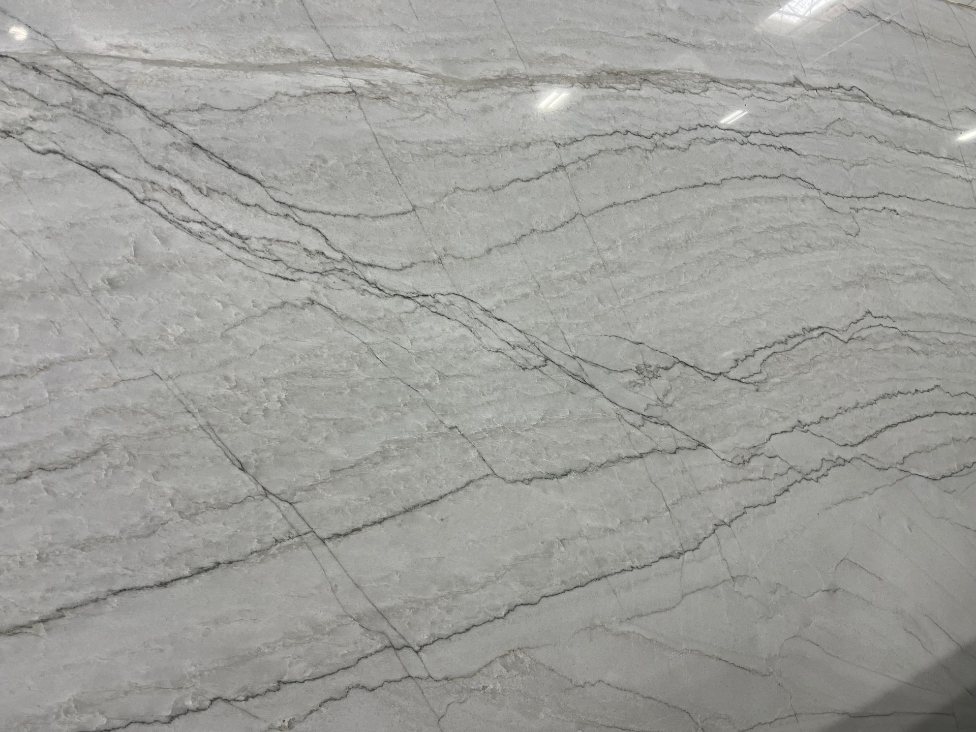 A close up of a white granite counter top