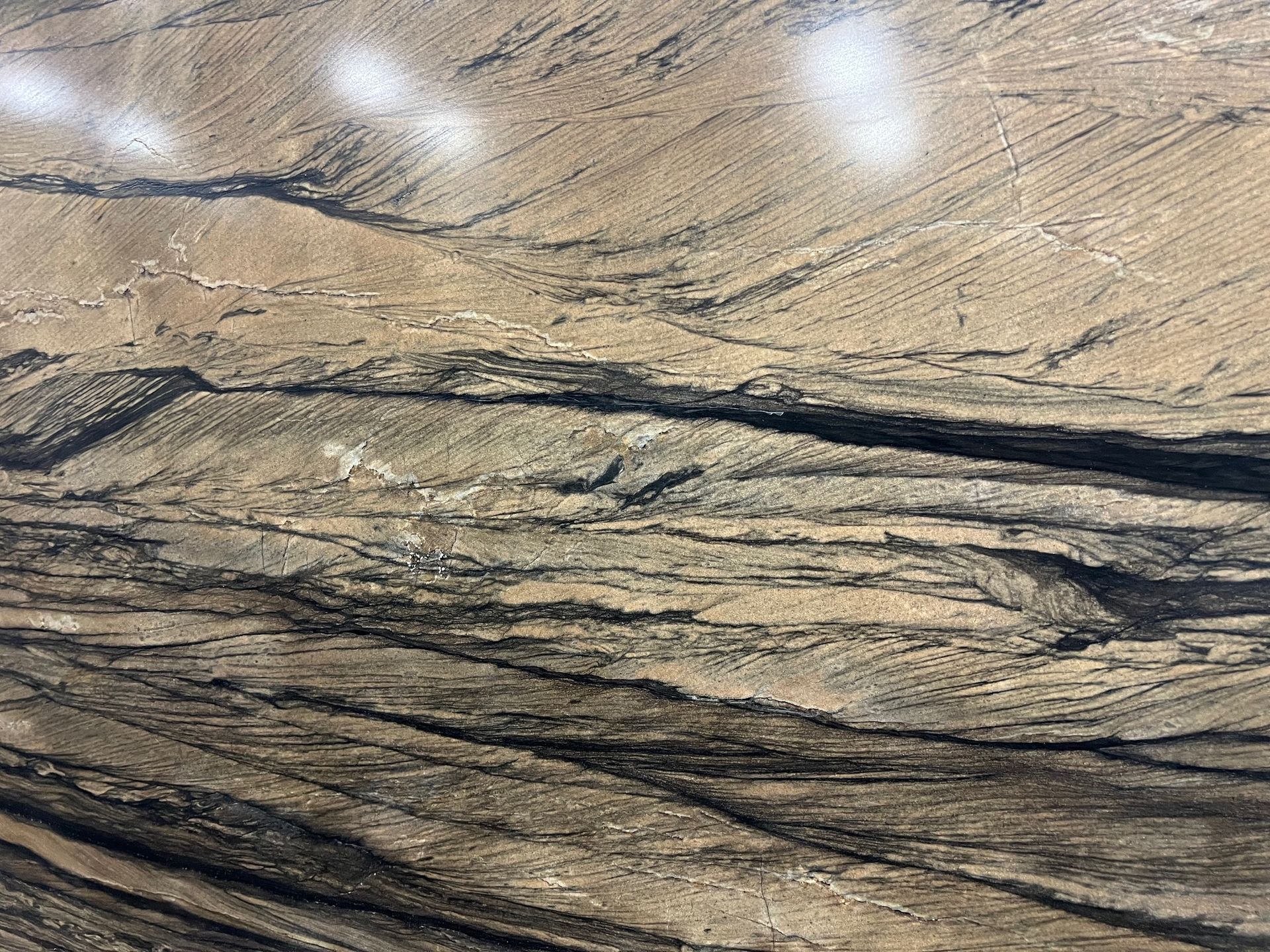 A close up of a piece of wood that looks like a mountain