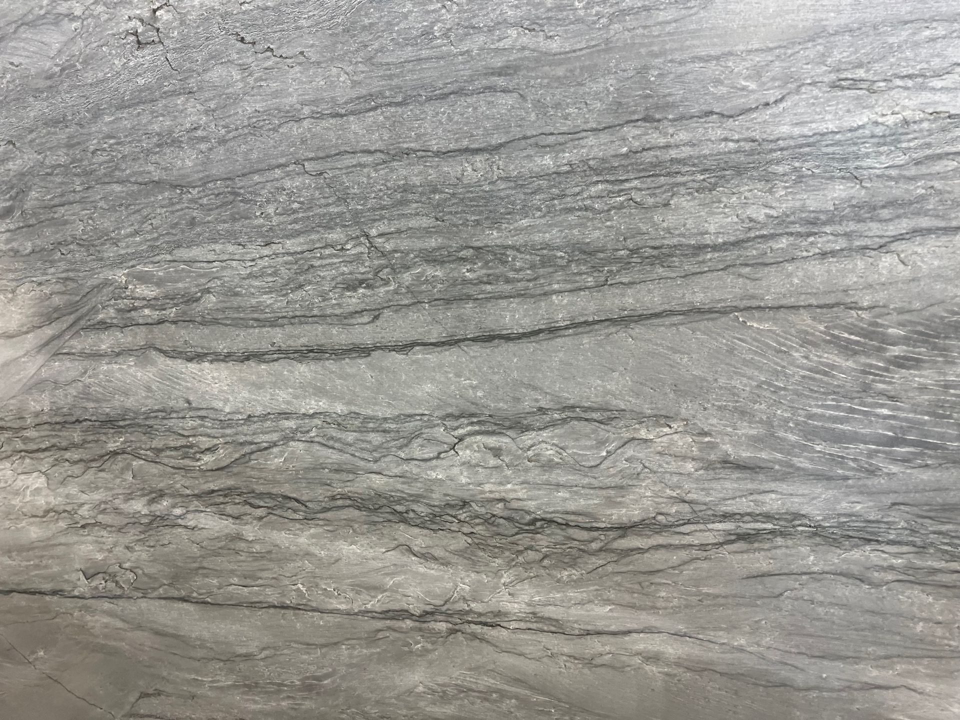 A close up of a gray granite counter top