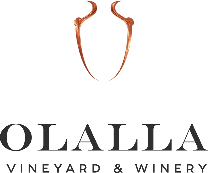 A logo for olalla vineyard and winery with a vase in the middle