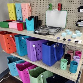 A shelf filled with lots of colorful plastic bags and containers.