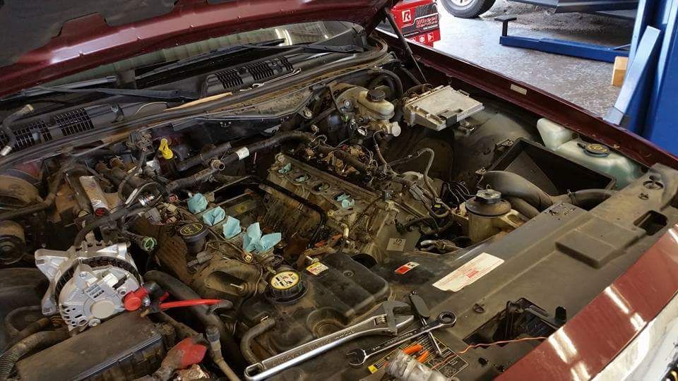 Engine Bay Open During Vehicle Repair And Inspection | New Dimensions Automotive