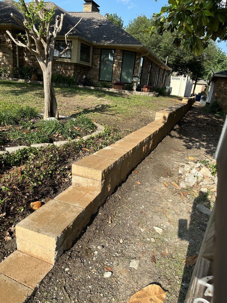 A large house with a lot of windows and a garage on a rainy day.