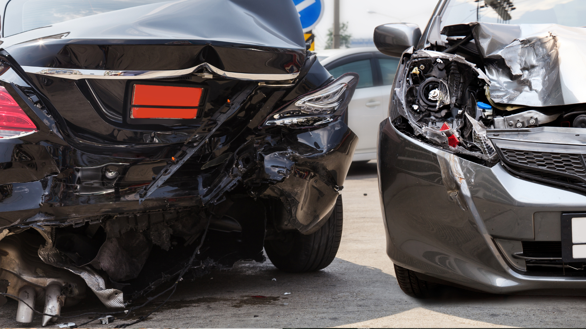 Two cars are damaged in a car accident.