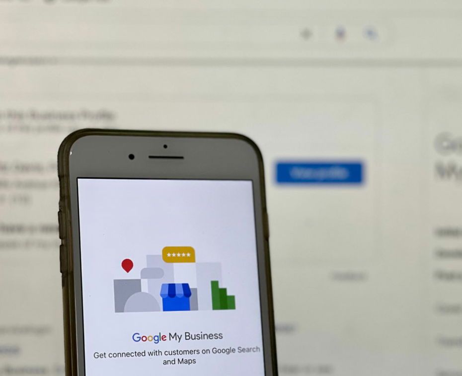 A cell phone is displaying the google my business app showing results of local SEO.