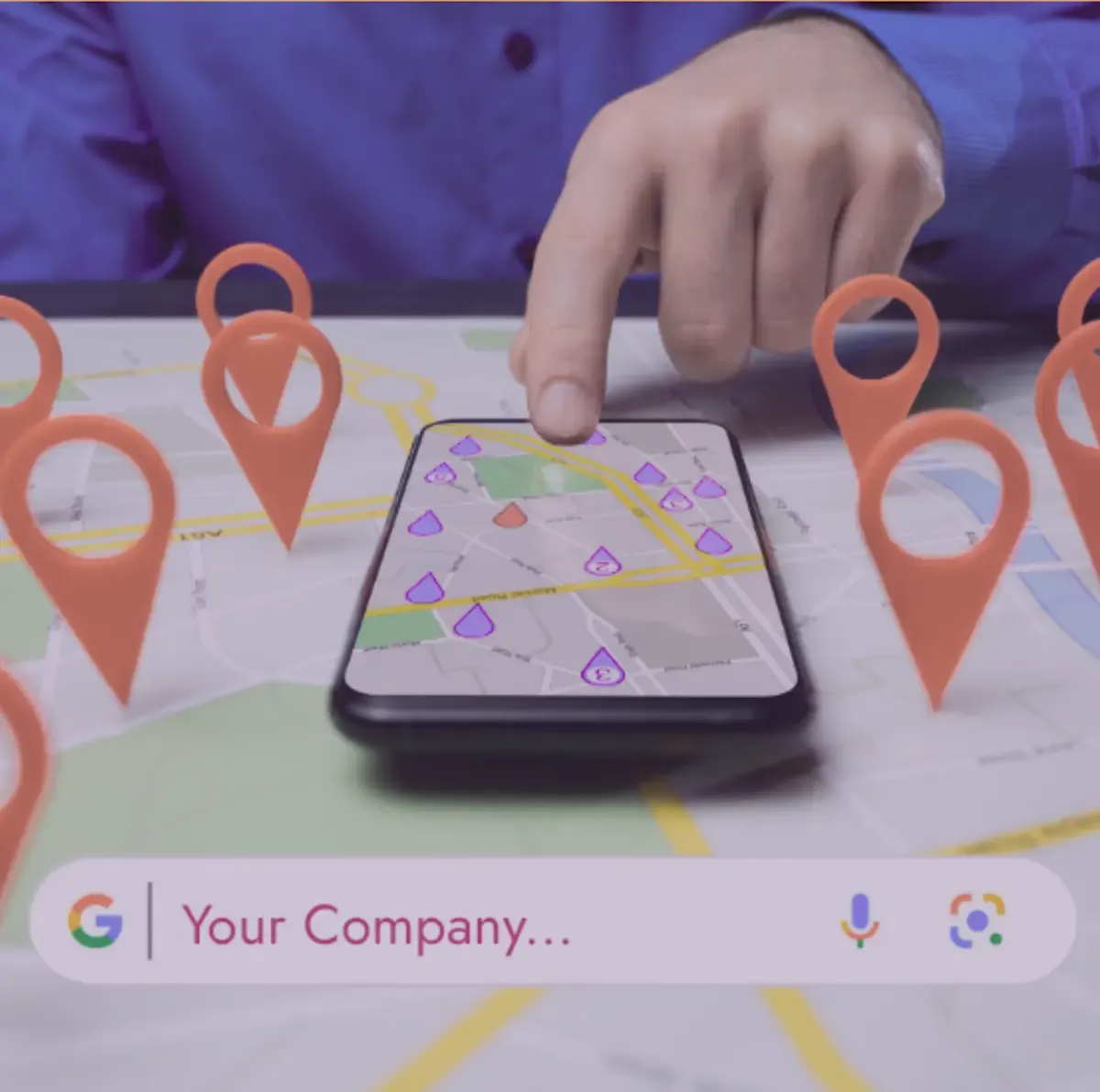Person using a smartphone with a map on a table surrounded by red location pins; Google search bar visible.
