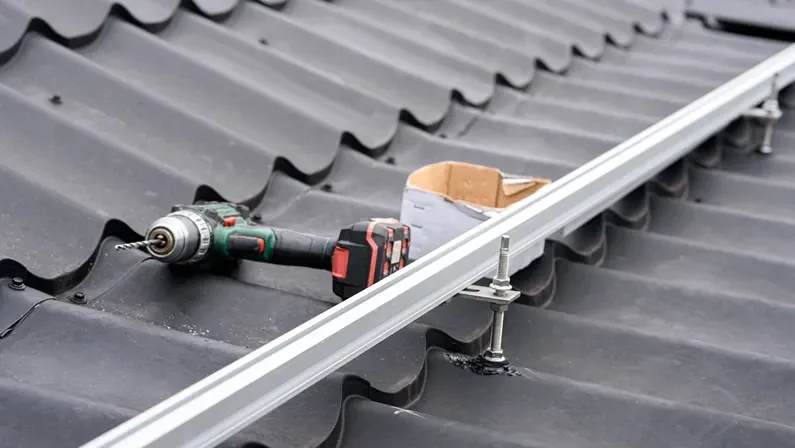 Brackets solar panel mounting system. Process of mounting solar power system on the roof. Turnkey solar power system, service works. Green energy. Rooftop solar power system