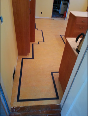 A hallway with a black line on the floor