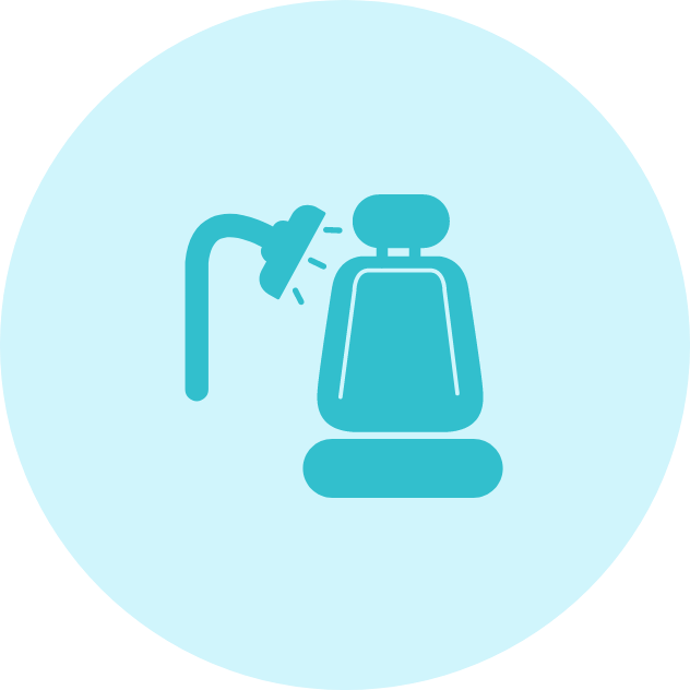 Blue car seat being sprayed with a shower head, within a blue circle.