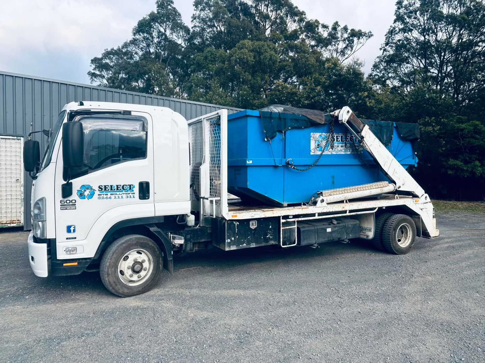 White Isuzu Truck With Blue Dumpster on the Back — Select Site Solutions in South Nowra, NSW