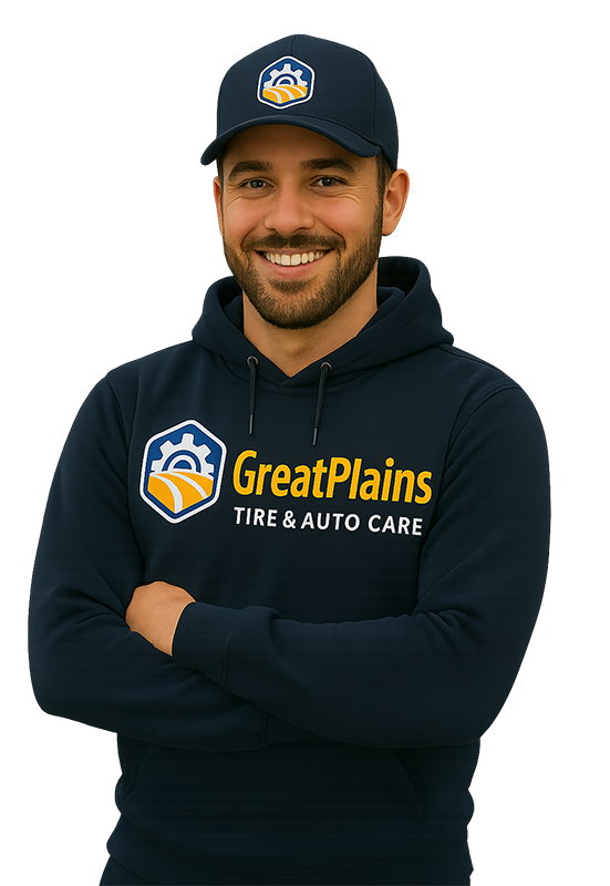 Man wearing GreatPlains Fire & Auto Care hat and hoodie, smiling with arms crossed.