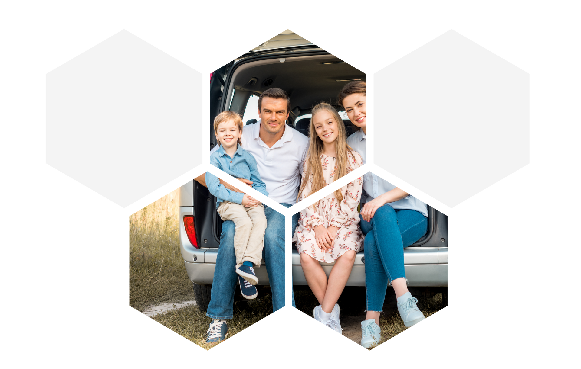 Family of four sits in the back of a car, smiling.