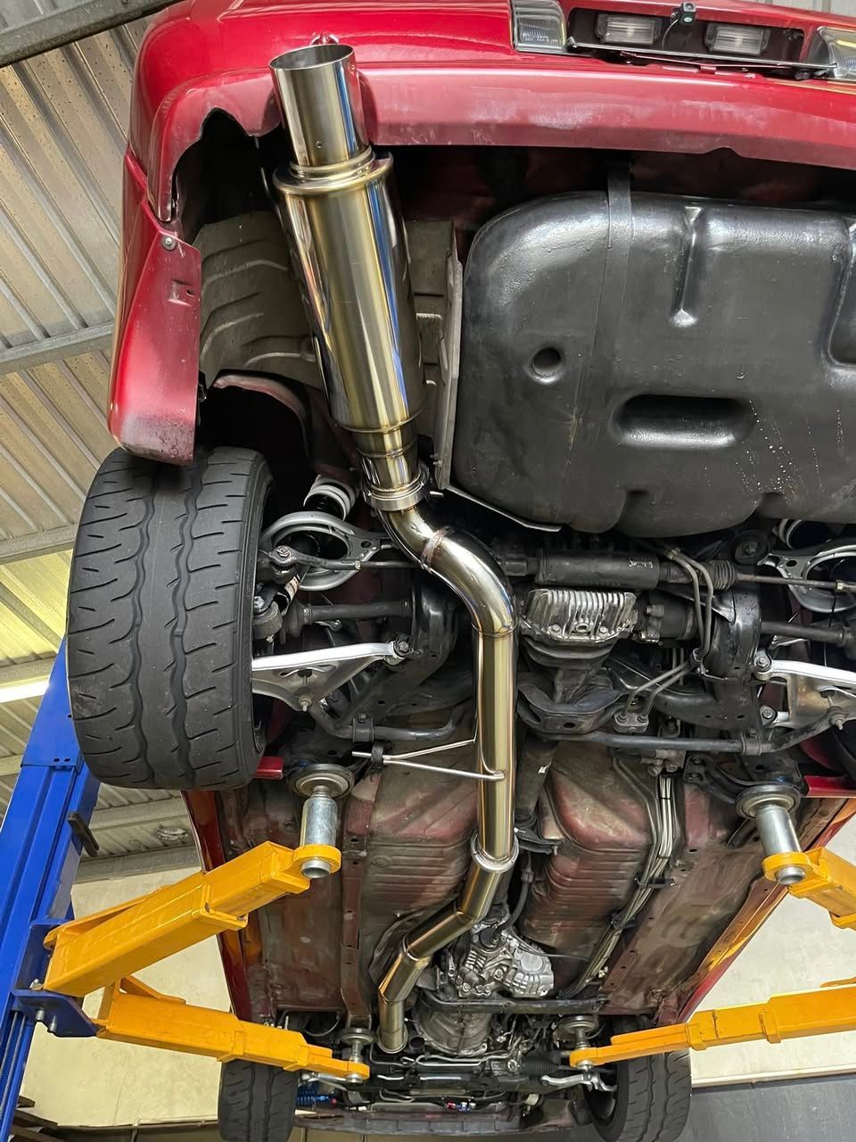 Underside View of a Car With a Shiny Exhaust System — SVS Auto Repairs and Dyno Tuning in Bungalow, QLD