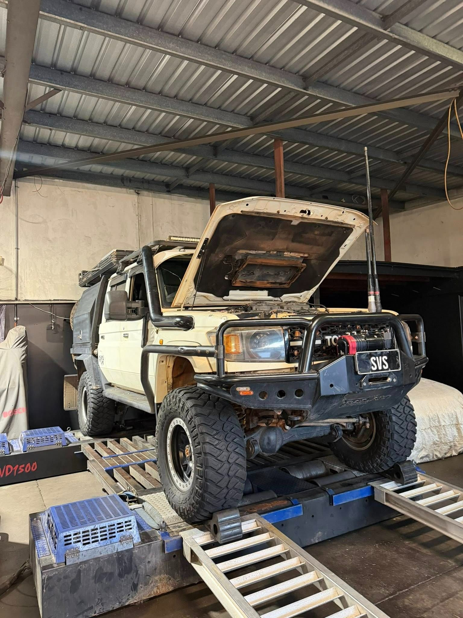 Beige 4x4 Truck With Open Hood on a Dyno in a Garage — SVS Auto Repairs and Dyno Tuning in Bungalow, QLD