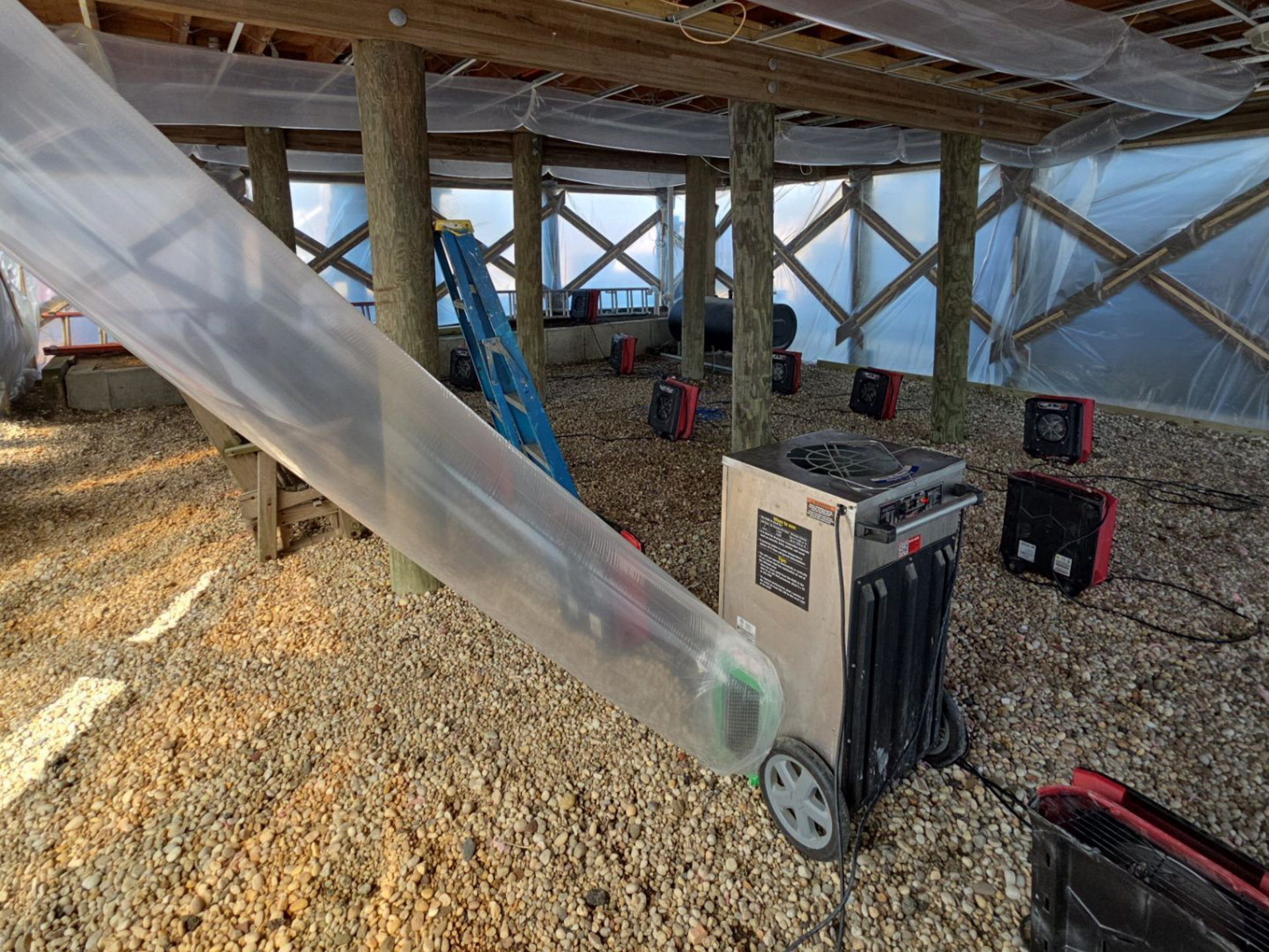 Structural drying heaters installed underneath a home in Mastic Beach, NY