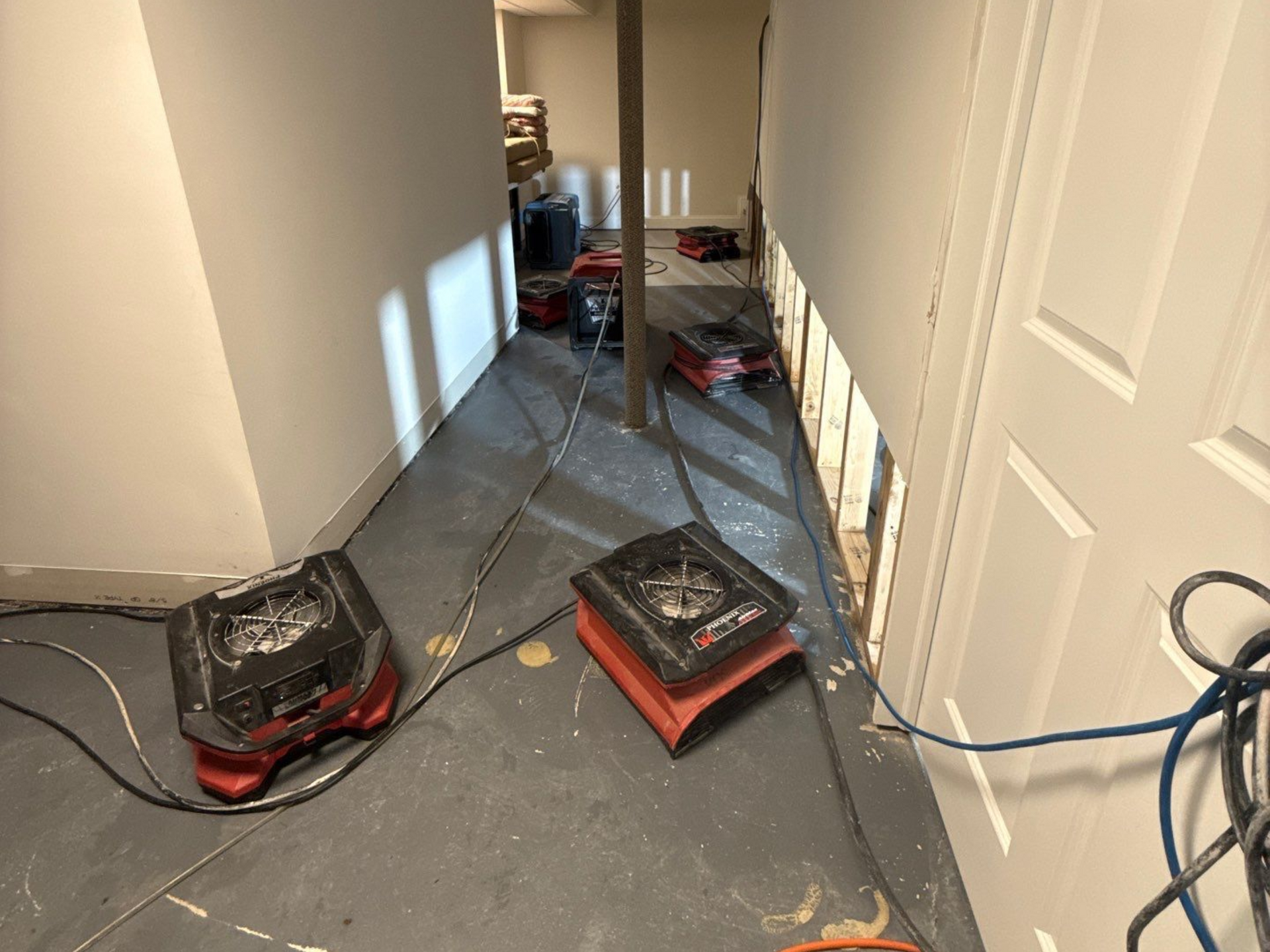 Drying and dehumidifying equipment setup at home in Eastport NY after sewage backup and sanitation.