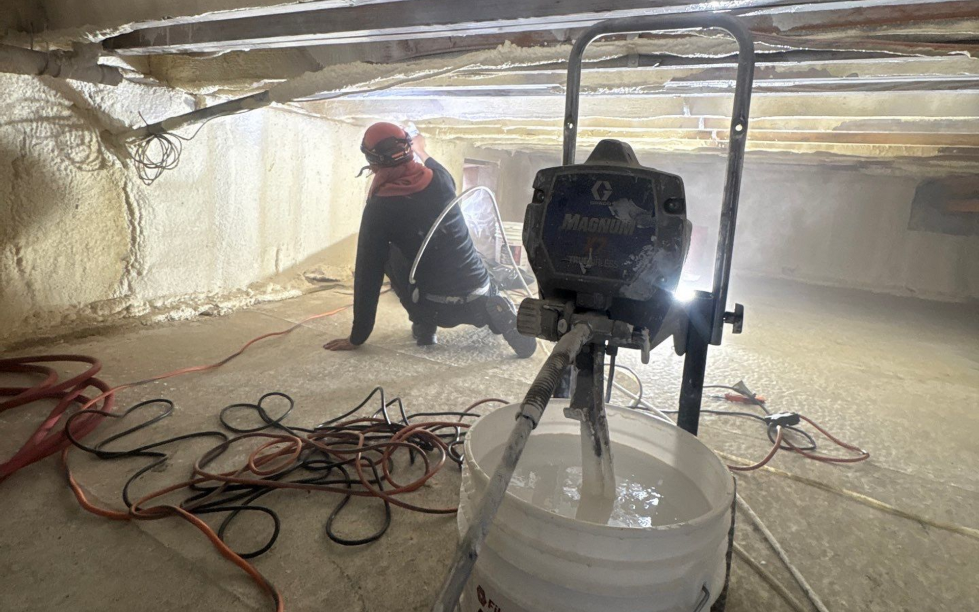 K.O.S. Technician applying mold encapsulation in a crawlspace in Quogue, New York