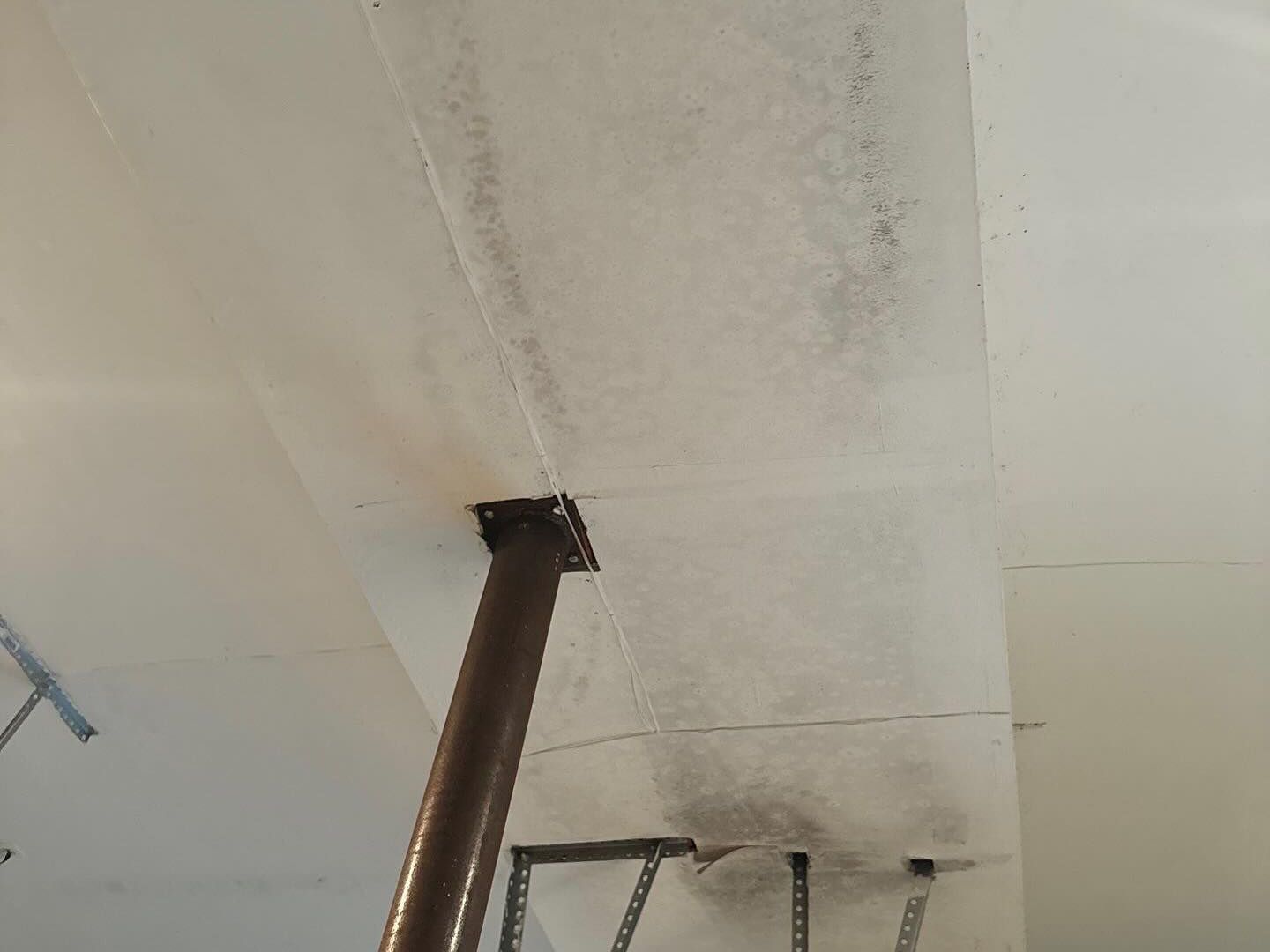 mold growth in garage from water damage. K.O.S. offers water damage restoration services on Long Island. 