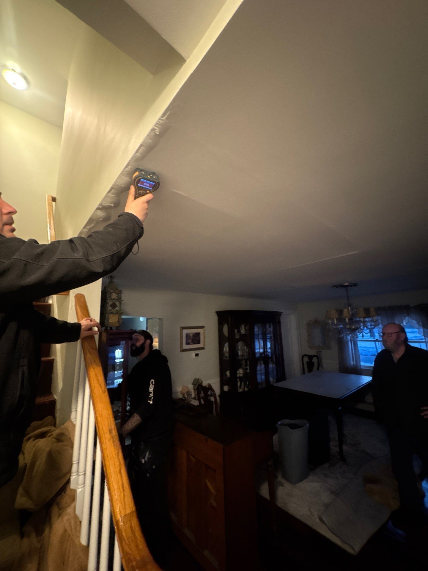 Taking moisture reading inside a home  in Patchogue NY