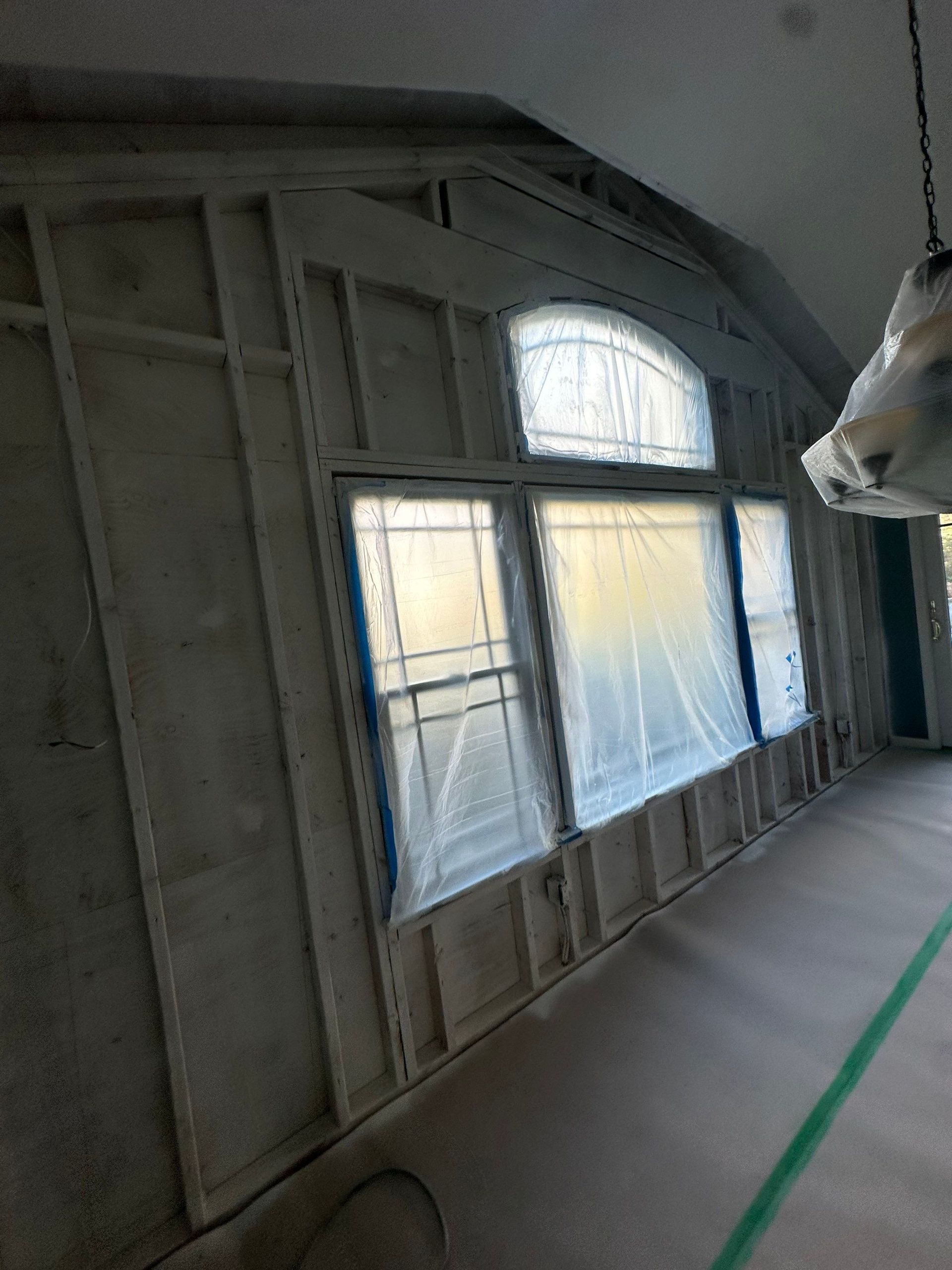 Competed mold encapsulation of living room wall studs at a home in Greenlawn New York, 