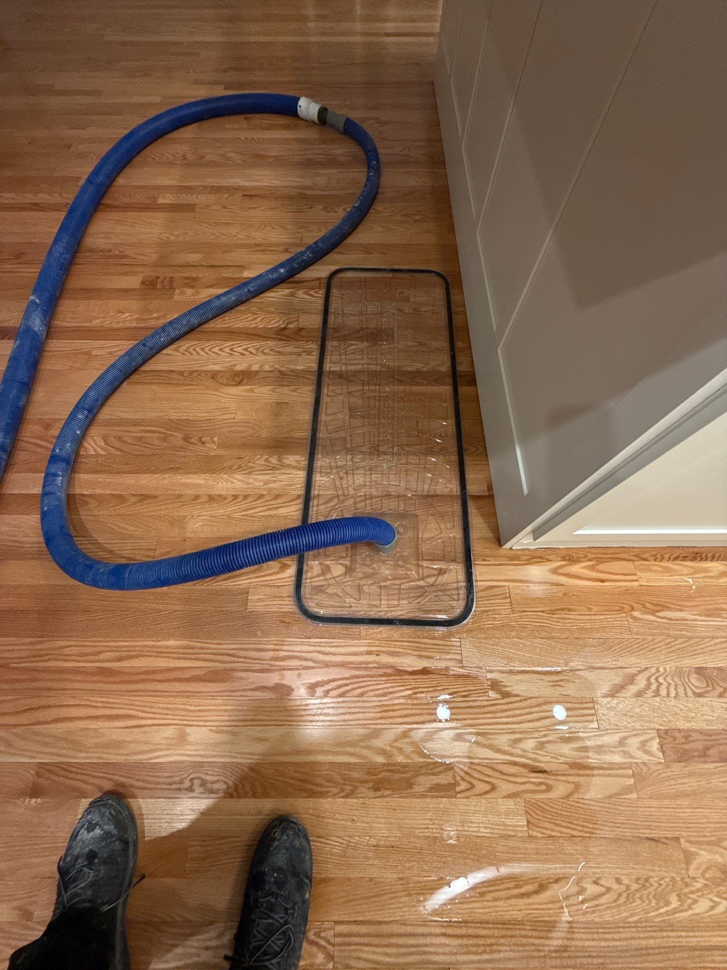 using specialized hardwood flooring drying mats at a home in Quogue NY