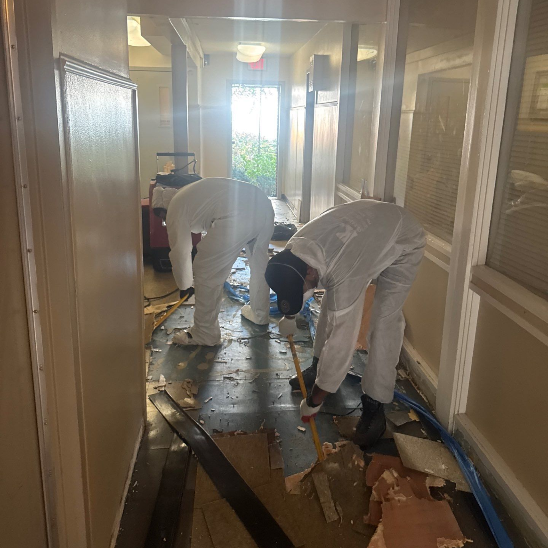 Removing damaged tiles after flooding in Huntington Station, NY