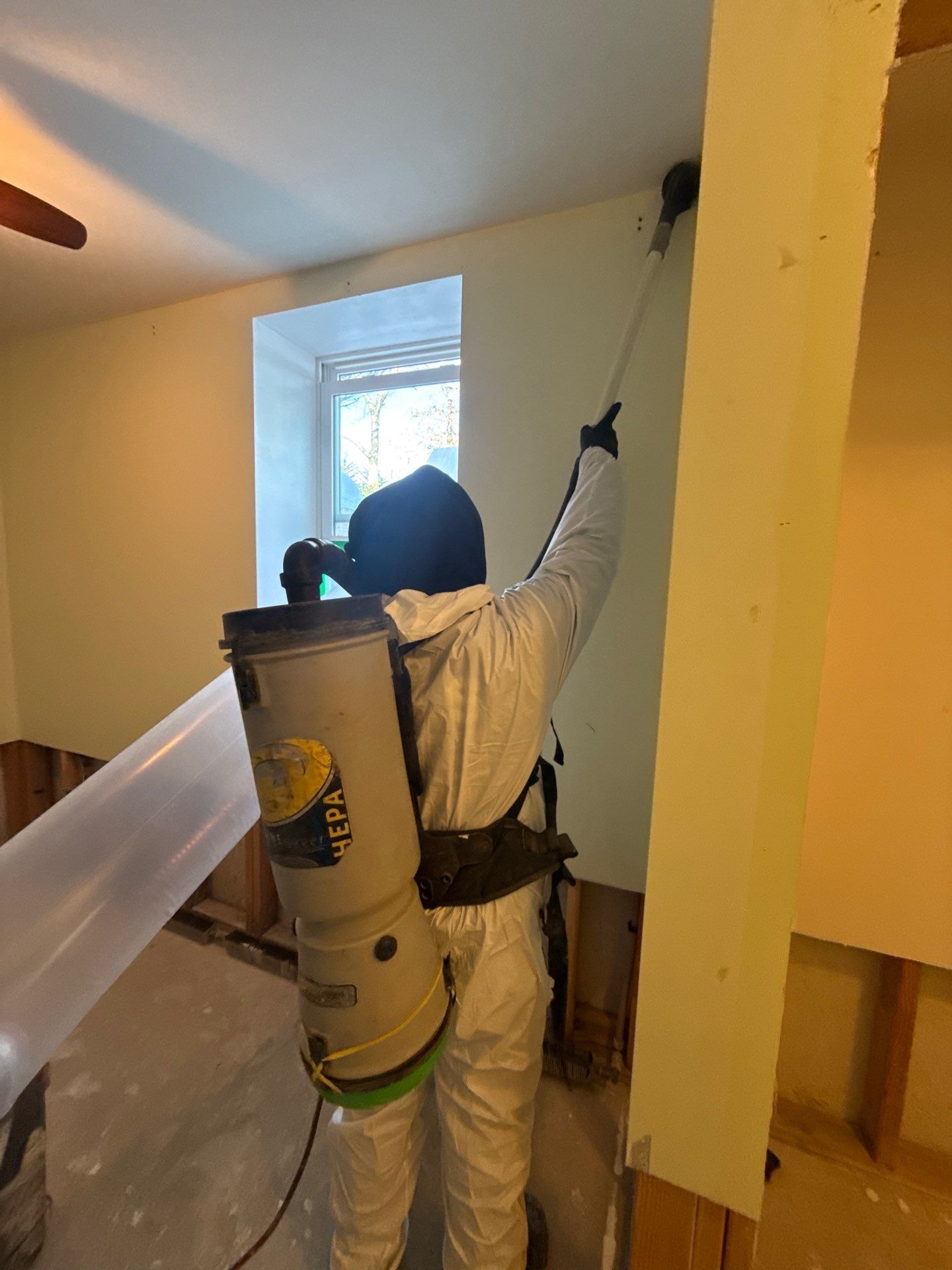 HEPA vacuuming of mold on wall at home in Westhampton NY