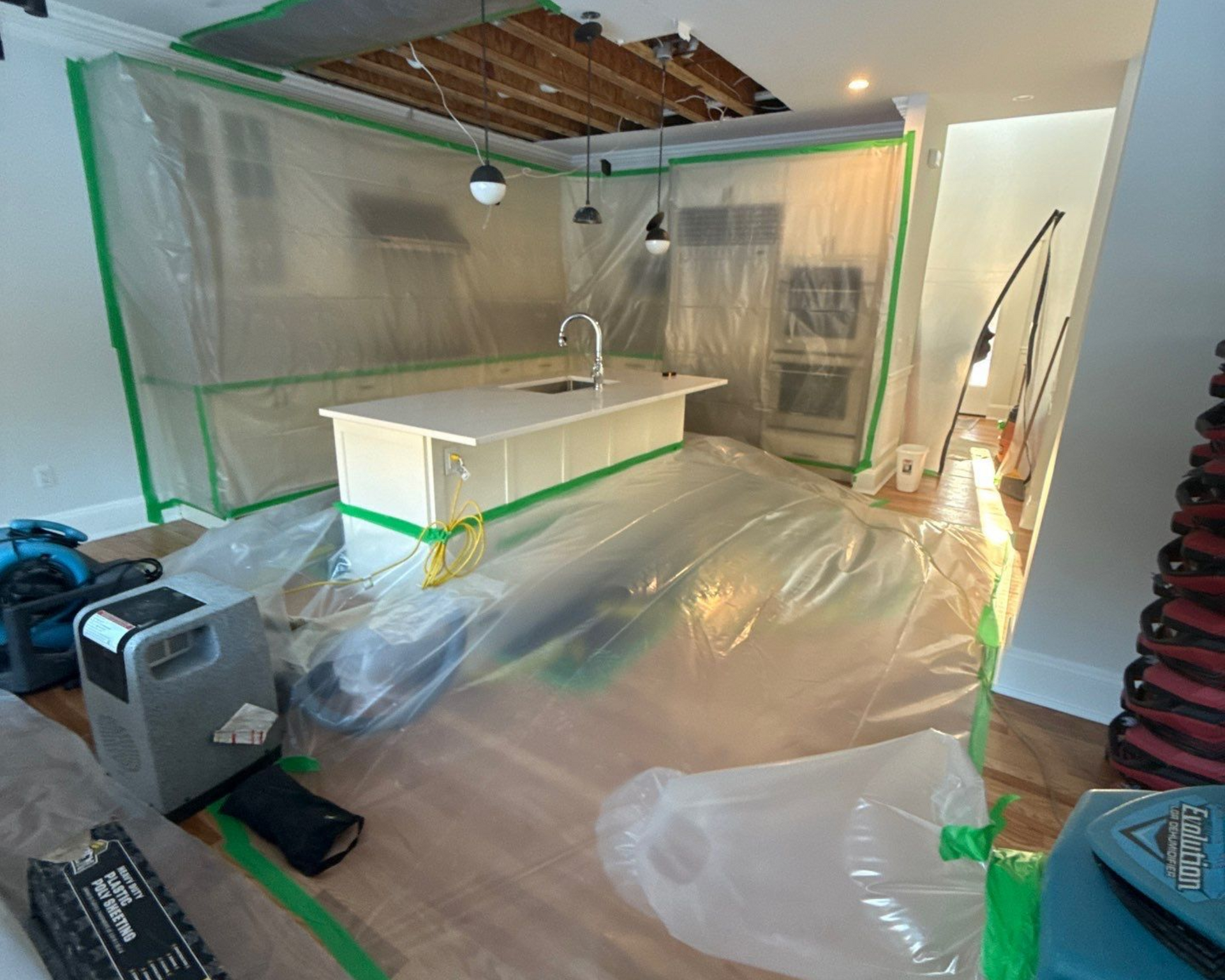 Water damage restoration of kitchen and hardwood flooring in Quogue NY after flooding.