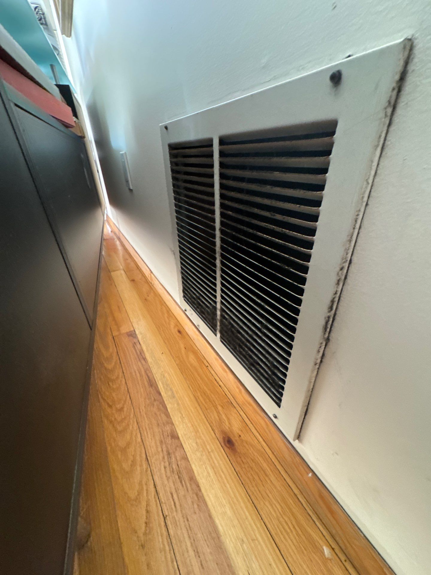 IICRC-certified technician performing soot cleanup after fire damage in a Long Island home