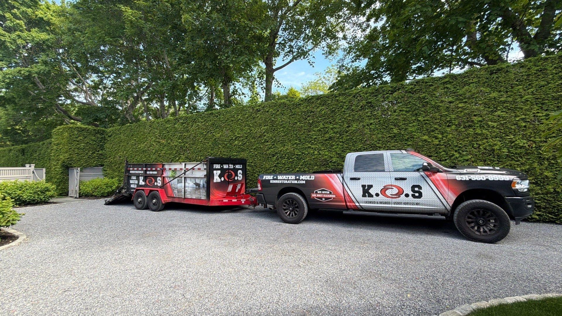 K.O.S. Restoration truck arriving for water damage restoration at an East Hampton, NY pool house