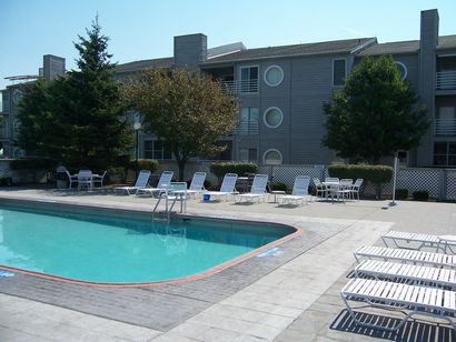 A large swimming pool in front of a building