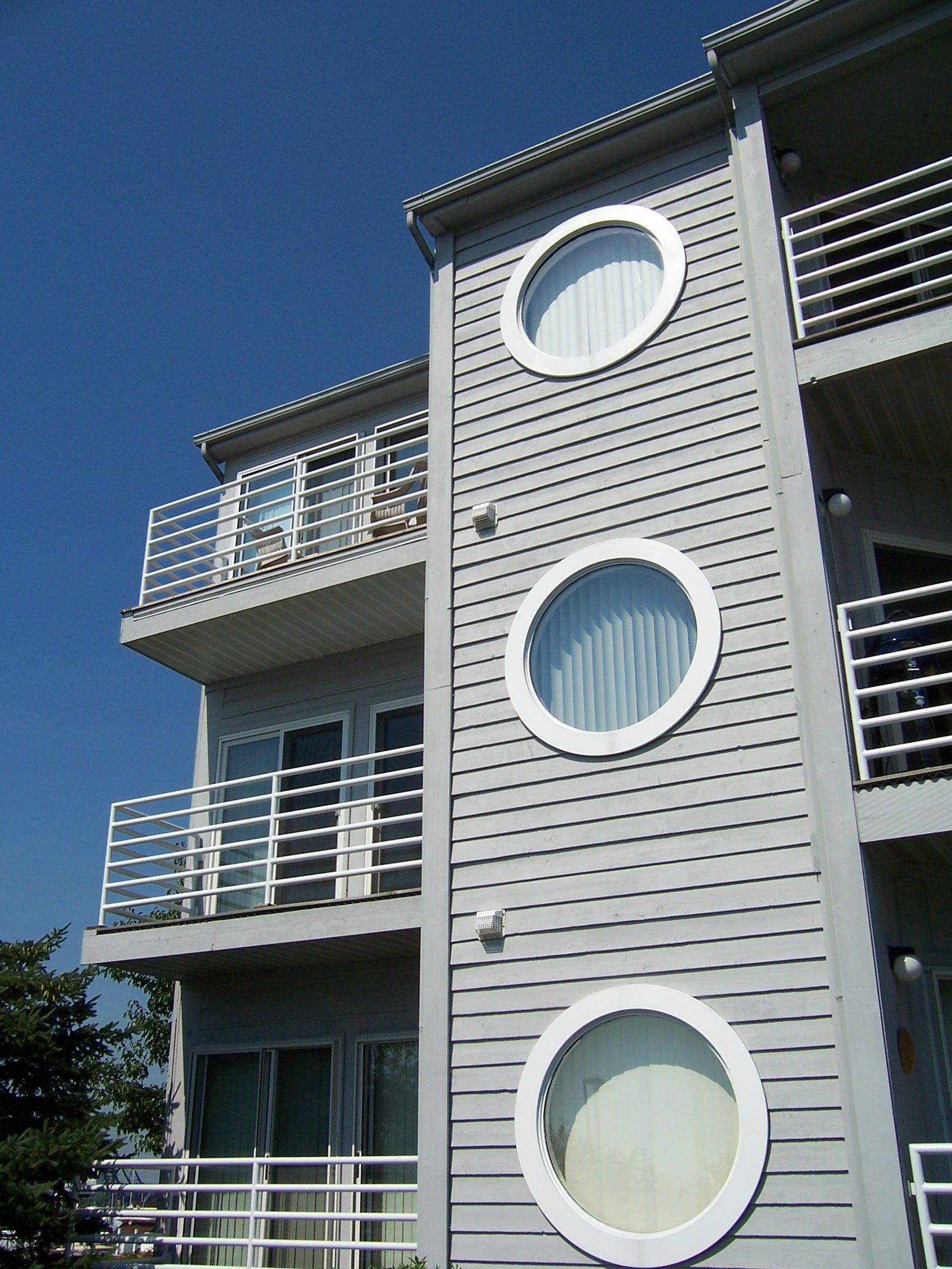 A building with three round windows on the side