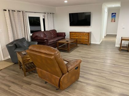 A living room filled with furniture and a flat screen tv.