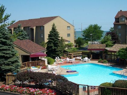 A large swimming pool in front of a building