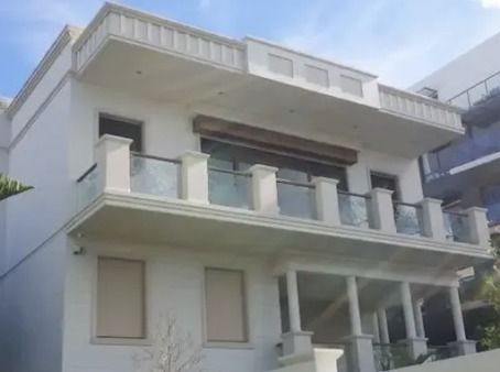 A Large White House With A Balcony And Columns — Rendering By Yilmaz P/L In Wollongong, NSW