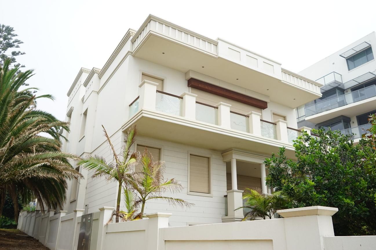 A Large White House With Palm Trees In Front Of It — Rendering By Yilmaz P/L In Wollongong, NSW